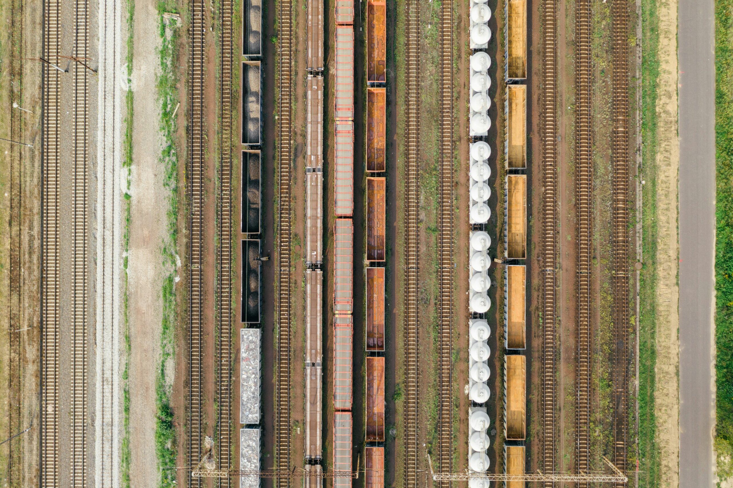 an aerial view of a train yard with several trains